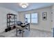 Bright office space featuring a rustic desk, shelving, and neutral decor at 1006 Fendley St, Woodstock, GA 30188