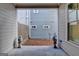 Charming covered patio with decorative statues and view of the backyard at 1006 Fendley St, Woodstock, GA 30188