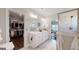 Bright bathroom with dual sink vanity, walk-in shower and access to large walk-in closet at 100 Maple Leaf Rd, Sharpsburg, GA 30277