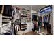 Spacious walk-in closet with ample shelving and hanging storage, plus convenient seating at 100 Maple Leaf Rd, Sharpsburg, GA 30277