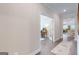 View of the hallway with hardwood flooring and a glimpse into the office and living room at 100 Maple Leaf Rd, Sharpsburg, GA 30277
