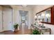 Hallway featuring hardwood floors and natural light, leading to the living area at 100 Maple Leaf Rd, Sharpsburg, GA 30277