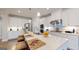 Kitchen with white cabinets, stainless steel appliances, and large island with seating at 100 Maple Leaf Rd, Sharpsburg, GA 30277