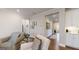 Open-concept living area with hardwood floors, plush seating, and decorative accents at 100 Maple Leaf Rd, Sharpsburg, GA 30277