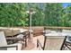Relaxing back deck featuring ample seating, dining, grill, and a deck heater at 1211 Fly Rod Ln, Loganville, GA 30052