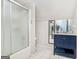 Functional bathroom featuring a shower/tub and vanity with sink, mirror, and lower cabinet at 1211 Fly Rod Ln, Loganville, GA 30052