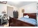 Cozy bedroom with a large bed, dark wood dresser, and plenty of natural light at 1211 Fly Rod Ln, Loganville, GA 30052