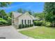 Inviting home with an attached garage, lush greenery, and a well-kept lawn at 1211 Fly Rod Ln, Loganville, GA 30052