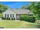 Charming single-story home featuring a cozy front porch and well-maintained landscaping at 1211 Fly Rod Ln, Loganville, GA 30052