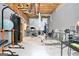 Unfinished basement home gym features assorted weight training and fitness equipment at 1211 Fly Rod Ln, Loganville, GA 30052