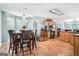 Open kitchen and dining area featuring stainless steel appliances and hardwood floors at 1211 Fly Rod Ln, Loganville, GA 30052
