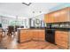 Well-appointed kitchen with wood cabinets, granite countertops, and modern appliances at 1211 Fly Rod Ln, Loganville, GA 30052