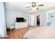 The main bedroom features a ceiling fan, television, walk-in closet, and a connecting bathroom at 1211 Fly Rod Ln, Loganville, GA 30052