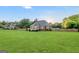 Large backyard featuring a well-maintained lawn and a wooden fence, perfect for outdoor activities and privacy at 161 Pleasant Grove Rd, Mcdonough, GA 30252