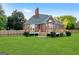 A spacious backyard features a wooden deck, complemented by a lush green lawn perfect for outdoor activities at 161 Pleasant Grove Rd, Mcdonough, GA 30252