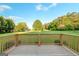 The home features a wood deck overlooking a large grassy backyard at 161 Pleasant Grove Rd, Mcdonough, GA 30252
