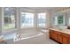 Spa-like bathroom with soaking tub, double windows offering natural light, and a modern vanity area at 161 Pleasant Grove Rd, Mcdonough, GA 30252