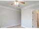 A simple bedroom is shown with standard ceiling fan at 161 Pleasant Grove Rd, Mcdonough, GA 30252