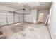 Spacious garage interior featuring a double-door, ample room for storage, and access to the house at 161 Pleasant Grove Rd, Mcdonough, GA 30252