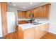 Spacious kitchen offers wooden cabinets, stainless steel appliances, bright countertops, and a double stainless sink at 161 Pleasant Grove Rd, Mcdonough, GA 30252