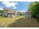 Expansive backyard with a well-manicured lawn, storage shed and a cozy patio area perfect for outdoor entertaining at 207 Brookstone Dr, Carrollton, GA 30116