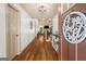 Welcoming foyer with gleaming hardwood floors leading to a staircase and a view of the living area at 207 Brookstone Dr, Carrollton, GA 30116