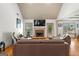Inviting living room featuring a stone fireplace and comfortable seating arrangement at 207 Brookstone Dr, Carrollton, GA 30116