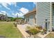 Inviting outdoor patio area with comfortable seating and potted plants, perfect for relaxing and entertaining at 207 Brookstone Dr, Carrollton, GA 30116
