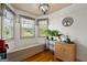 Cozy sitting area with natural light, a window seat, and decorative plants at 207 Brookstone Dr, Carrollton, GA 30116