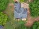 Aerial view of the house showcasing its roof, backyard, and surrounding greenery at 30 Stonewall Dr, Covington, GA 30016
