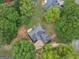 A home surrounded by lush, mature trees with a visible driveway and well-maintained lawn at 30 Stonewall Dr, Covington, GA 30016