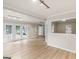 Open basement with hardwood floors, recessed lighting and access to the backyard at 30 Stonewall Dr, Covington, GA 30016