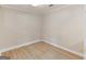 Simple basement room featuring hardwood floors, base molding, and recessed lighting at 30 Stonewall Dr, Covington, GA 30016