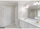 Bathroom features a double sink vanity, large mirror, and great lighting at 30 Stonewall Dr, Covington, GA 30016