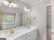 Bathroom features a double sink vanity, large mirror, and great lighting at 30 Stonewall Dr, Covington, GA 30016