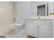 Cozy bathroom with a combined shower and tub, white toilet, and a bright vanity at 30 Stonewall Dr, Covington, GA 30016