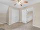 Bedroom with closet and a doorway to the hallway and staircase at 30 Stonewall Dr, Covington, GA 30016