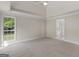 Comfortable carpeted bedroom with natural light and easy access to the bathroom, creating a relaxing space at 30 Stonewall Dr, Covington, GA 30016