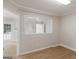 This bedroom offers a unique view of another room through a well-placed window at 30 Stonewall Dr, Covington, GA 30016