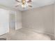 Bedroom featuring carpet flooring and a doorway to the hallway and staircase at 30 Stonewall Dr, Covington, GA 30016
