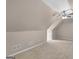 Large carpeted bedroom featuring neutral tones and sloped ceilings at 30 Stonewall Dr, Covington, GA 30016