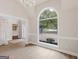 The dining room opens to the front yard, with high ceilings and vinyl floors under a chandelier fixture at 30 Stonewall Dr, Covington, GA 30016