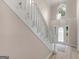 The Foyer features a large staircase and bright front door that provide a spacious and welcoming entrance at 30 Stonewall Dr, Covington, GA 30016
