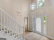 The Foyer features a large staircase and front door that provide a bright and spacious entrance at 30 Stonewall Dr, Covington, GA 30016