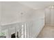 Hallway with carpet flooring featuring a view of the living room below at 30 Stonewall Dr, Covington, GA 30016