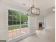 Living room with a fireplace, a large window and neutral-toned paint at 30 Stonewall Dr, Covington, GA 30016