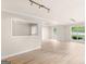 Bright open living room featuring hardwood floors, recessed lights, and large windows at 30 Stonewall Dr, Covington, GA 30016