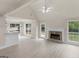 Open-concept living space with stone fireplace and lots of natural light at 30 Stonewall Dr, Covington, GA 30016