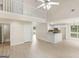 Open-concept living space flows into the kitchen with breakfast bar, perfect for modern living and entertaining at 30 Stonewall Dr, Covington, GA 30016