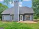 This home features a spacious backyard with newer siding and a patio area at 30 Stonewall Dr, Covington, GA 30016
